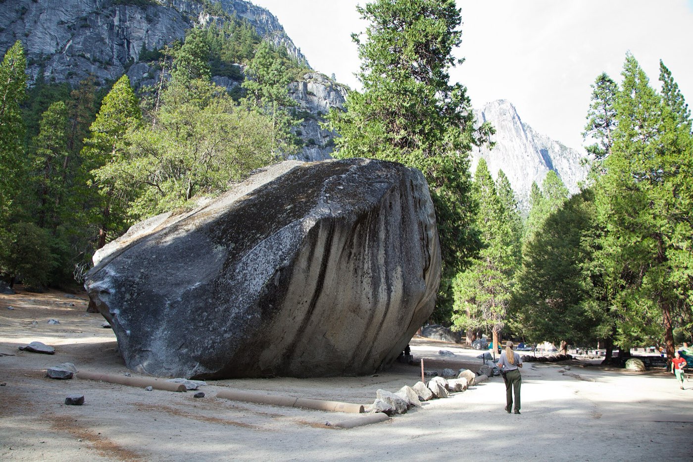 A boulderer working an outdoor problem