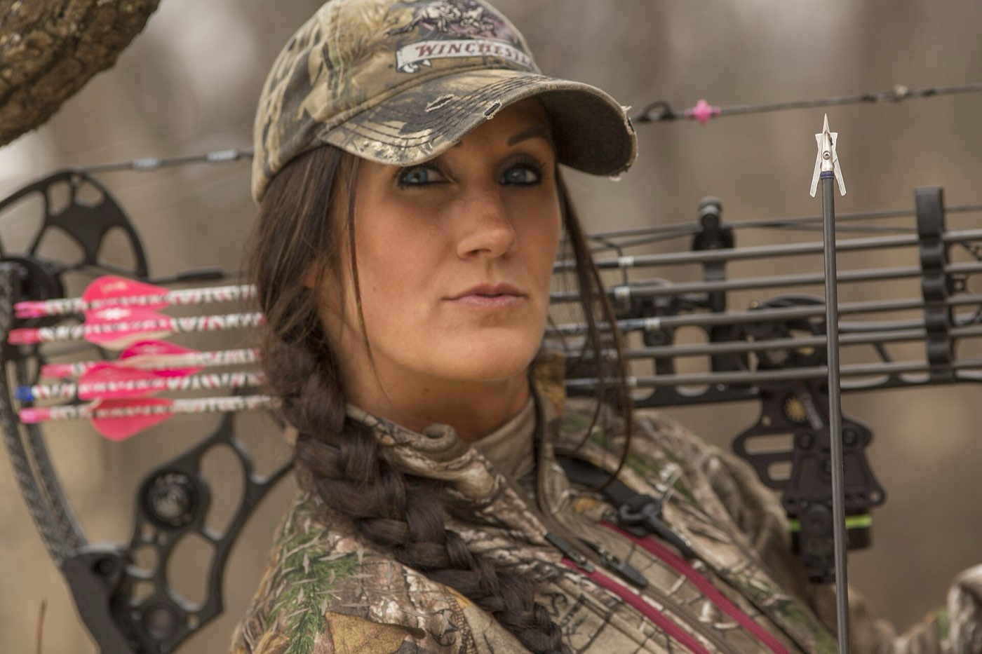 A bowhunter at full draw