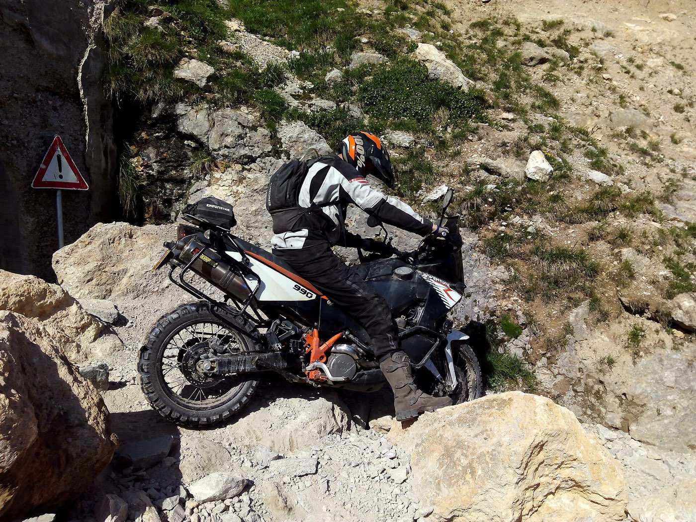A dual-sport bike working a dirt trail