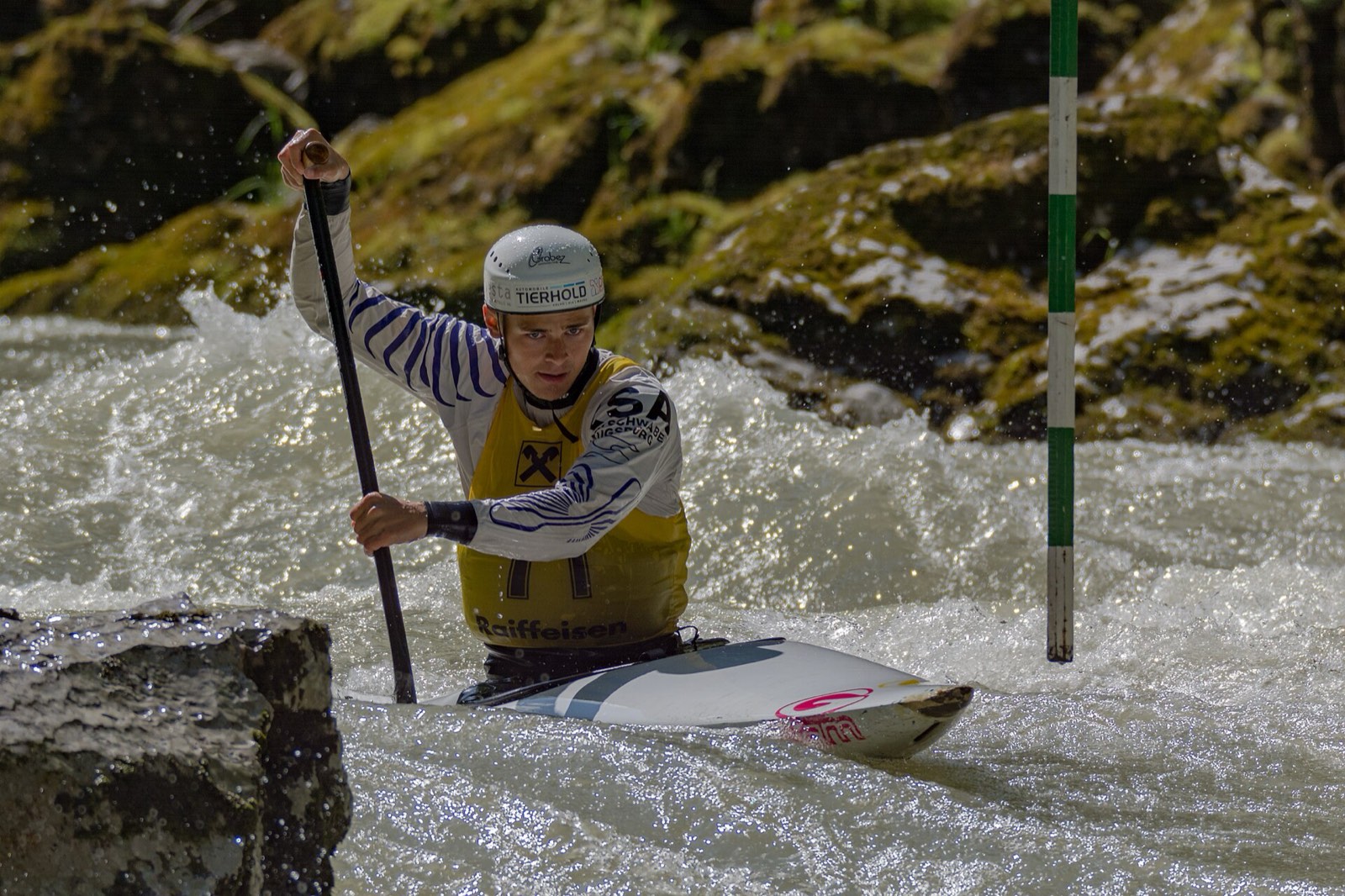 A kayaker working through whitewater